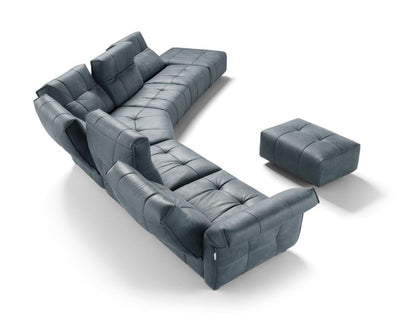 Aerial view of a Sospiro corner sectional configuration in blue-grey leather with a matching ottoman on white background