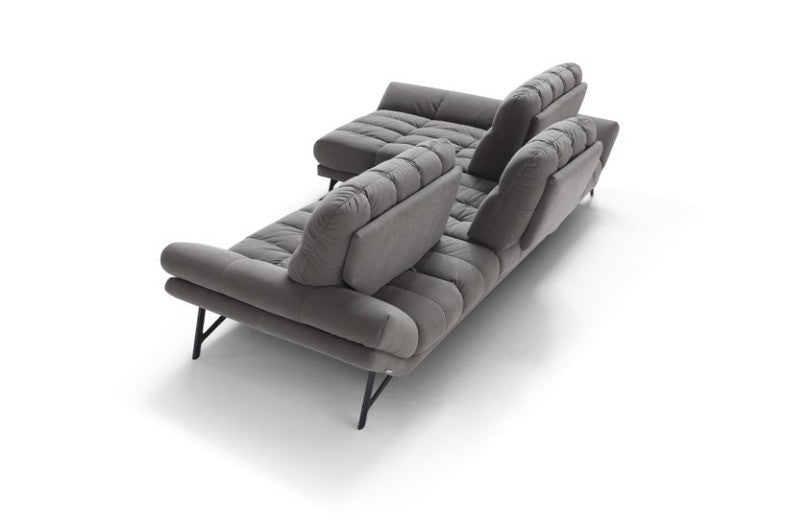 Spiga sectional sofa in grey fabric seen from behind, showing the tilting backrests and open metal base