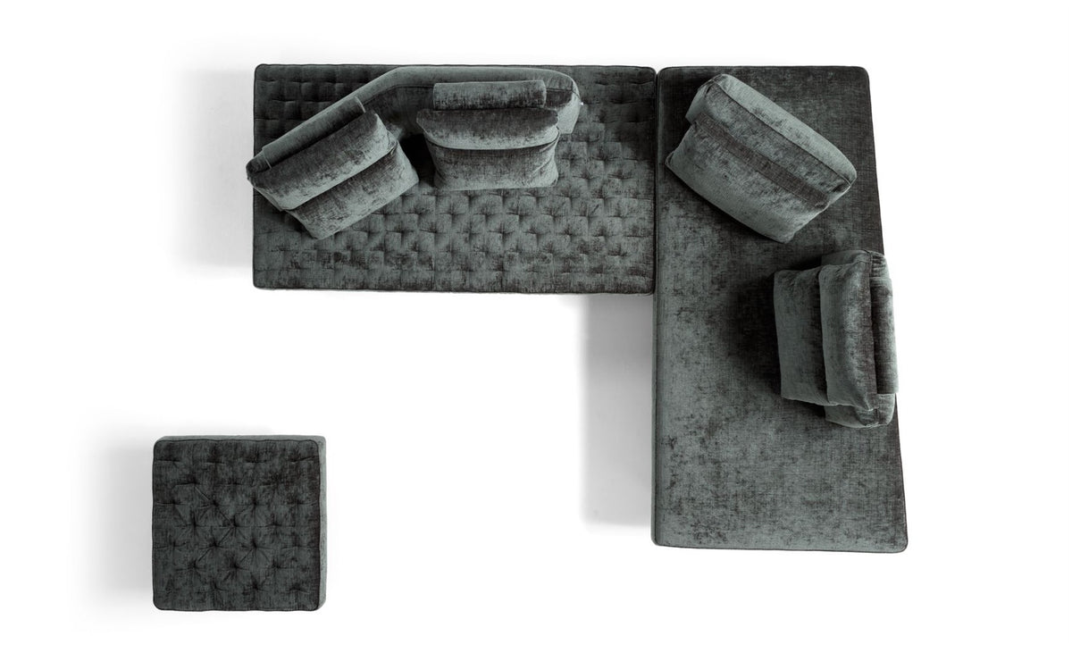 Top view of a Stor sectional composition with ottoman, showing quilted and smooth seats and freely placed back cushions