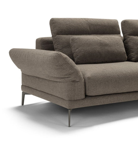 Detail of Tenco sofa armrest, backrest cushions and slim metal leg