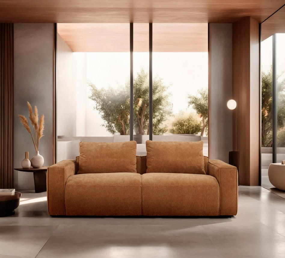 Tesoro sofa bed in rust fabric in a contemporary living room with wood ceiling and floor-to-ceiling windows