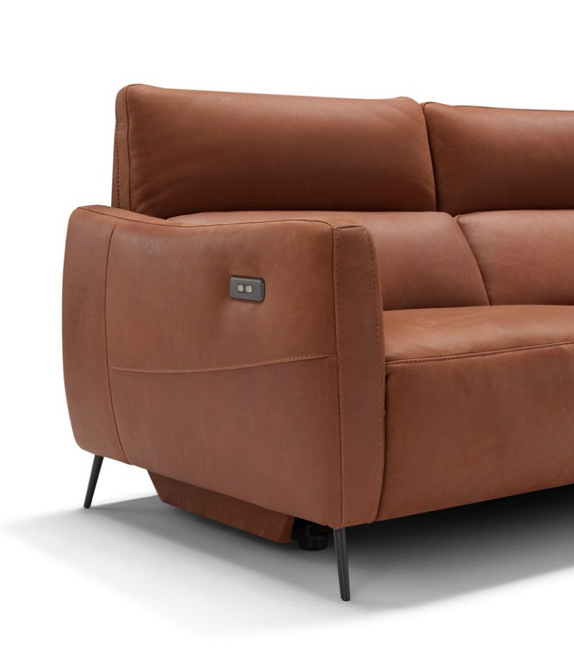 Close-up of the Valentini squared armrest in cognac leather with integrated recliner controls and slender black metal leg