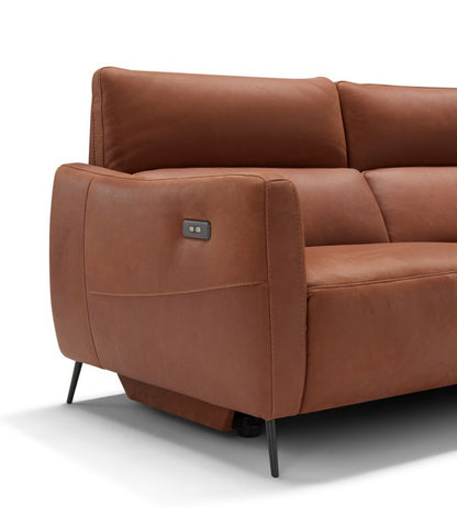 Close-up of the Valentini squared armrest in cognac leather with integrated recliner controls and slender black metal leg