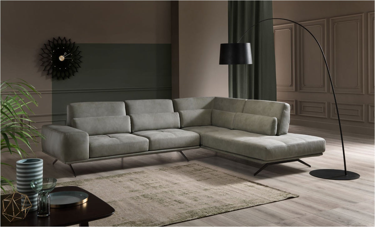 Vanoni sectional sofa in soft grey upholstery with open-end chaise longue and tilting backrests in a contemporary living room