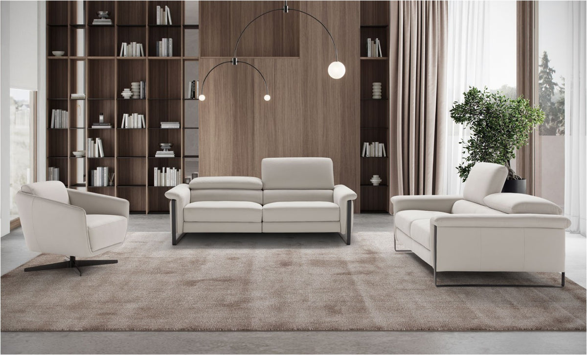Vitti modular sofas in light grey leather with adjustable headrests and black metal slate legs in a contemporary living room with wood shelving