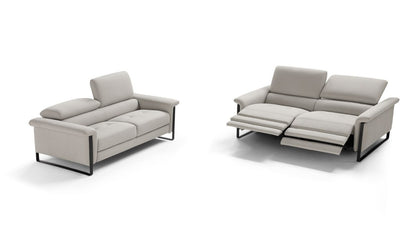 Two Vitti sofas in light grey leather on white background, one closed and one with both electric recliner seats extended