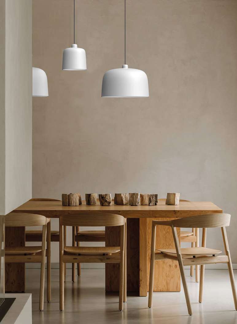 Luceplan Zile suspension lamp, white shade, over a wooden dining table